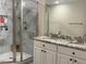 Elegant bathroom featuring a spacious shower and dual sink vanity with granite countertops at 4001 Newby Rd, Rocky Mount, NC 27804