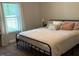 Comfortable bedroom with soft lighting, plush bedding, and large windows at 4001 Newby Rd, Rocky Mount, NC 27804