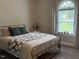 Bedroom with light-filled arched windows, natural light and cozy decor at 4001 Newby Rd, Rocky Mount, NC 27804