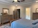 Comfortable bedroom with wooden furniture, including a dresser and a bedside table at 4001 Newby Rd, Rocky Mount, NC 27804