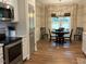 Cozy dining area with modern light fixture and view of the backyard at 4001 Newby Rd, Rocky Mount, NC 27804