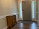 Warm entryway featuring wood floors and decorative cabinet at 4001 Newby Rd, Rocky Mount, NC 27804