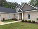 Charming brick home features manicured lawn, and arched windows at 4001 Newby Rd, Rocky Mount, NC 27804