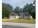 Charming brick home with a well-manicured lawn and attached two-car garage at 4001 Newby Rd, Rocky Mount, NC 27804