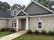 Welcoming front entrance with brick facade and landscaped garden beds at 4001 Newby Rd, Rocky Mount, NC 27804
