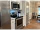 Modern kitchen with stainless steel appliances and white cabinets at 4001 Newby Rd, Rocky Mount, NC 27804