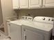 Functional laundry room with modern washer and dryer and ample storage at 4001 Newby Rd, Rocky Mount, NC 27804