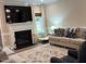 Bright living room with fireplace, large TV, neutral walls, and sliding glass doors to exterior at 4001 Newby Rd, Rocky Mount, NC 27804