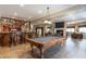Basement features a pool table, bar, and cozy seating area at 4038 Carpenter Pond Rd, Durham, NC 27703