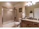 Bright bathroom featuring tub-shower combo, toilet, tile floors, and vanity with sink at 4038 Carpenter Pond Rd, Durham, NC 27703