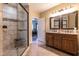 Bathroom with tiled shower and double sink vanity at 4038 Carpenter Pond Rd, Durham, NC 27703
