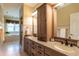 A spacious bathroom with double sinks and a separate tub and shower is adjacent to the bedroom at 4038 Carpenter Pond Rd, Durham, NC 27703