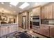 Bright kitchen featuring stainless steel appliances, a gas cooktop, and ample cabinet space at 4038 Carpenter Pond Rd, Durham, NC 27703