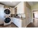 Laundry room featuring washer/dryer and plenty of storage space, sink and countertop at 4038 Carpenter Pond Rd, Durham, NC 27703