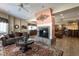 Living room with fireplace, sofa, and large windows for natural light at 4038 Carpenter Pond Rd, Durham, NC 27703
