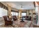 Spacious living room featuring cozy seating around decorative rug and a fireplace at 4038 Carpenter Pond Rd, Durham, NC 27703