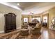 Large primary bedroom suite with sitting area and four poster bed at 4038 Carpenter Pond Rd, Durham, NC 27703