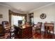 Spacious office featuring a large desk, comfortable seating, and natural light at 4038 Carpenter Pond Rd, Durham, NC 27703