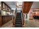 Elegant staircase with patterned carpet and wooden banister to second floor at 4038 Carpenter Pond Rd, Durham, NC 27703