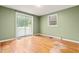 Bedroom with a sliding glass door and a window at 407 W Sixth St, Siler City, NC 27344