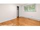 Bright bedroom featuring wood floors, a large window and closet space at 407 W Sixth St, Siler City, NC 27344
