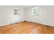 Comfortable bedroom with hardwood floors and two large windows that provide plenty of natural light at 407 W Sixth St, Siler City, NC 27344