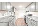 Modern kitchen featuring updated appliances, gray cabinets and new countertops at 407 W Sixth St, Siler City, NC 27344