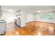 Inviting living room featuring hardwood floors and open access to the updated kitchen and dining space at 407 W Sixth St, Siler City, NC 27344