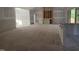 Open-concept living room featuring fireplace with natural light and neutral walls at 4248 Jacks Creek Trl, Burlington, NC 27215