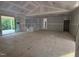 Spacious living room with sliding glass doors offering view of lush green landscape at 4248 Jacks Creek Trl, Burlington, NC 27215