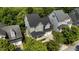 Aerial view showcases a beautifully landscaped home with a charming front porch at 436 Edgepine Dr, Holly Springs, NC 27540