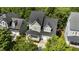 Aerial view of a two-story home with a front porch and well-manicured lawn at 436 Edgepine Dr, Holly Springs, NC 27540