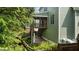 Exterior view with a deck, screened porch, stairs, and landscaped surroundings at 436 Edgepine Dr, Holly Springs, NC 27540