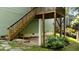 Rear of the house shows a wooden staircase leading to a partially covered patio area at 436 Edgepine Dr, Holly Springs, NC 27540