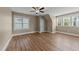 Bedroom with lots of natural light, multiple windows, and warm-toned paint at 436 Edgepine Dr, Holly Springs, NC 27540
