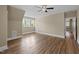 Spacious bedroom with wood-look floors and sun-filled windows at 436 Edgepine Dr, Holly Springs, NC 27540