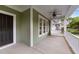Inviting front porch features a swing, ceiling fan, and ample space for relaxing at 436 Edgepine Dr, Holly Springs, NC 27540