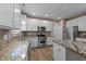 Spacious kitchen with stainless steel appliances, granite countertops, and ample cabinet space at 436 Edgepine Dr, Holly Springs, NC 27540