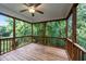 Secluded screened porch with wood flooring and serene views of the surrounding greenery at 436 Edgepine Dr, Holly Springs, NC 27540