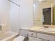 Functional bathroom with a shower-tub combo, vanity with storage, and standard fixtures at 4646 Fawnbrook Cir, Raleigh, NC 27612