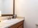 Well-lit bathroom with a framed mirror, decorative faucet, and a clean, functional design at 4646 Fawnbrook Cir, Raleigh, NC 27612