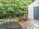 Back deck with lush trees and greenery at 4646 Fawnbrook Cir, Raleigh, NC 27612