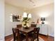 Comfortable dining area with elegant lighting and views into the kitchen at 4646 Fawnbrook Cir, Raleigh, NC 27612