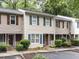 Exterior of the property with brick accents, landscaping, and parking at 4646 Fawnbrook Cir, Raleigh, NC 27612