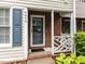 Close up of the front entry with brick accents and charming porch railing at 4646 Fawnbrook Cir, Raleigh, NC 27612