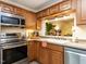 A modern kitchen with stainless steel appliances and ample counter space at 4646 Fawnbrook Cir, Raleigh, NC 27612