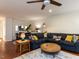 Open concept living room with ample seating, featuring a comfortable sectional sofa and contemporary decor at 4646 Fawnbrook Cir, Raleigh, NC 27612