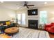 Cozy living room features a fireplace and comfortable seating area at 4646 Fawnbrook Cir, Raleigh, NC 27612