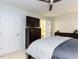 Bright bedroom with ceiling fan, TV, dresser and view to Primary bathroom at 4646 Fawnbrook Cir, Raleigh, NC 27612