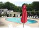 Resort style community pool with ample lounge chairs and nearby changing facilities at 4646 Fawnbrook Cir, Raleigh, NC 27612